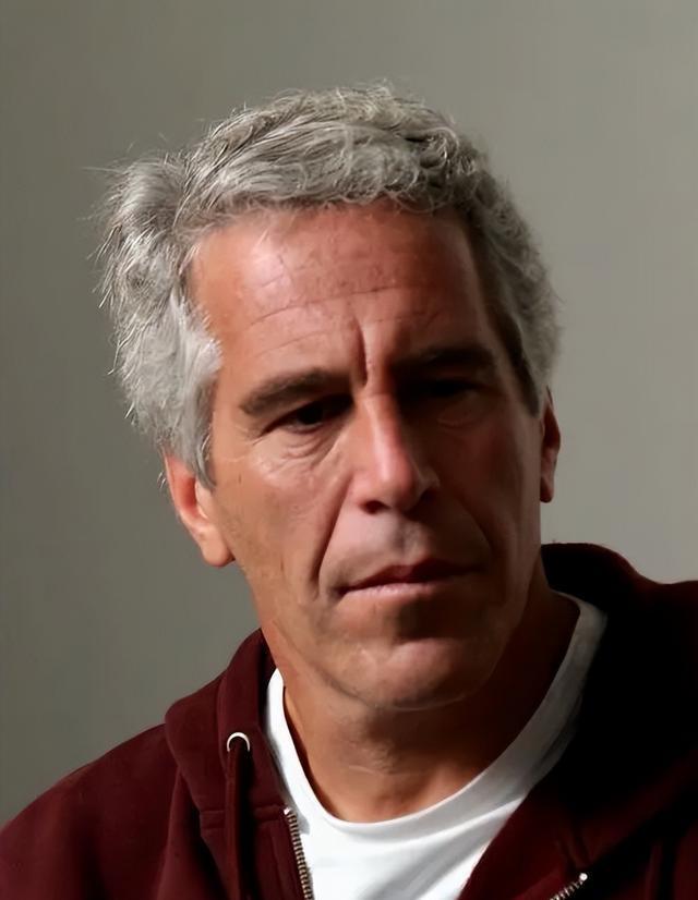 A person with grey hair Description automatically generated